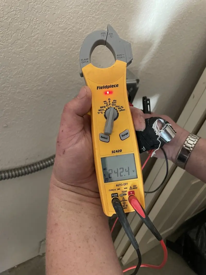 Voltage testing with clamp meter during Electrical Installation Services in McFarland